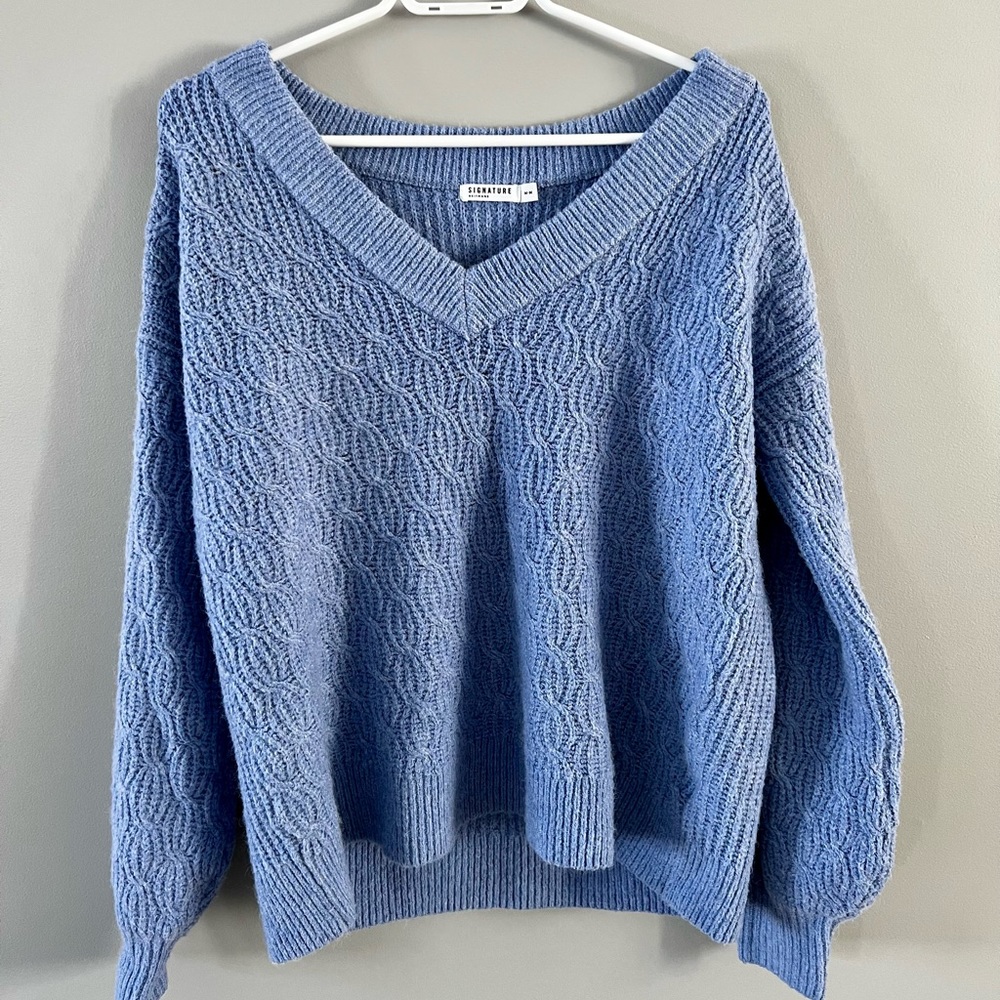 Blue V-neck knitted sweater